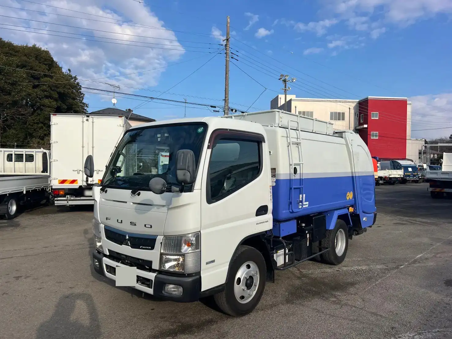 三菱 キャンター 小型 パッカー車 巻き込み式 回転ダンプ式の中古トラック画像1