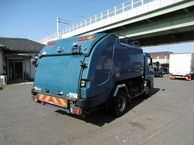 三菱 キャンター 小型 パッカー車 巻き込み式 回転ダンプ式の中古トラック画像2
